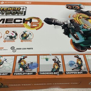 Puede incluir: Una caja para un kit de robot de codificaci&oacute;n mec&aacute;nica Teach Tech Mech 5. La caja presenta una imagen del robot en su forma ensamblada, con un esquema de color verde y naranja. La caja tambi&eacute;n incluye im&aacute;genes de cinco configuraciones de robots diferentes que se pueden construir con el kit, incluyendo un robot de dibujo, un robot de carretilla elevadora, un robot de lanzamiento, un robot de agarre y un robot de f&uacute;tbol. La caja indica que el kit incluye m&aacute;s de 220 piezas.