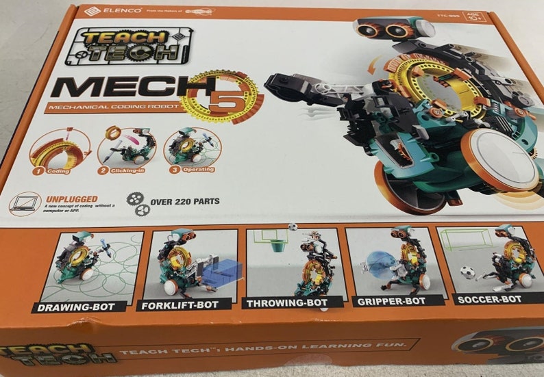 Puede incluir: Una caja para un kit de robot de codificaci&oacute;n mec&aacute;nica Teach Tech Mech 5. La caja presenta una imagen del robot en su forma ensamblada, con un esquema de color verde y naranja. La caja tambi&eacute;n incluye im&aacute;genes de cinco configuraciones de robots diferentes que se pueden construir con el kit, incluyendo un robot de dibujo, un robot de carretilla elevadora, un robot de lanzamiento, un robot de agarre y un robot de f&uacute;tbol. La caja indica que el kit incluye m&aacute;s de 220 piezas.
