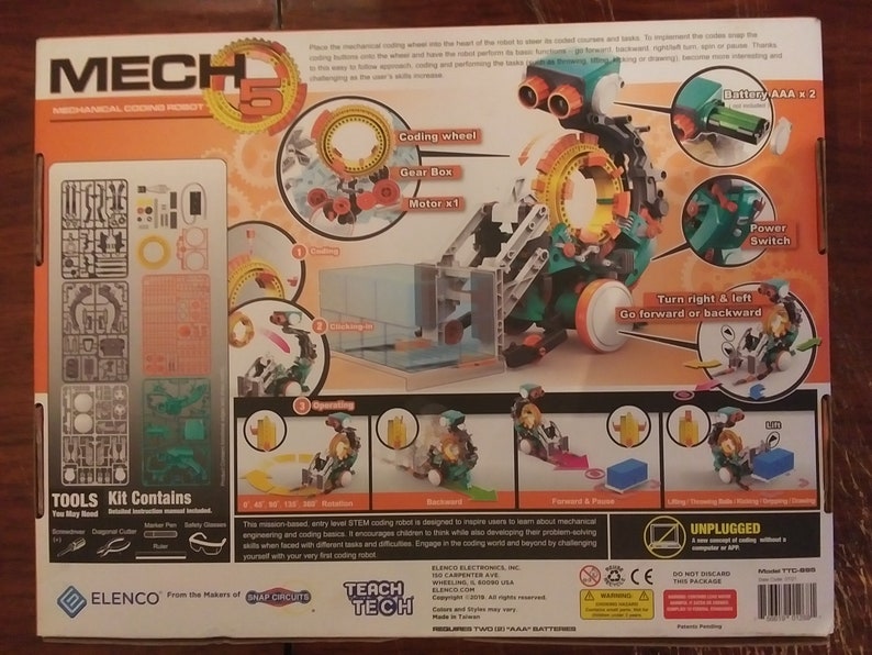 Puede incluir: Un kit de robot de codificaci&oacute;n mec&aacute;nica verde y naranja con las palabras 'Mech 5' y 'Teach Tech' en la caja. El robot tiene una rueda de codificaci&oacute;n, una caja de engranajes y un motor. La caja tambi&eacute;n incluye herramientas e instrucciones.