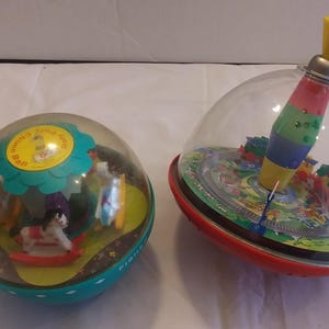 Vintage 1970s Fisher Price Rolly Polly Chime Ball and Tin Litho Top Toys
