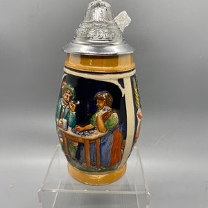 Highly detailed vintage beer stein. Made in Germany. Flip top keeps your beer nicely fresh.