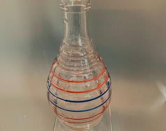 Hazel Atlas glass decanter/vase. Red and blue bands. In excellent condition. Numbered on bottom.