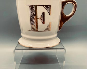 Large vintage Anthropologie mug with letter E. Gold lettering and trim.