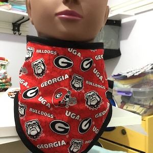 May include: Red and black bandana with a repeated pattern of the University of Georgia logo, the words "Georgia Bulldogs", and a bulldog mascot.