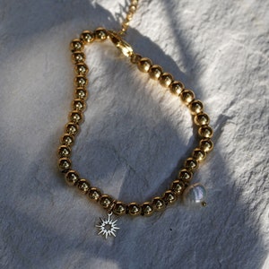 Gold pearl bracelet with pendant, women&#39;s men&#39;s bracelet with freshwater pearl made of 316 L stainless steel with 18 carat gold plating, stainless steel jewelry