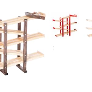 May include: A wooden toy race track with four levels. The track is made of light wood and the supports are dark brown. The track is set up in a zig-zag pattern.