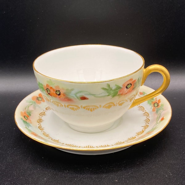 Jean Pouyat (J.P.L) teacup and saucer, white porcelain, hand painted with poppies, gold details, rims and handle.  ANT 1890-1902 France