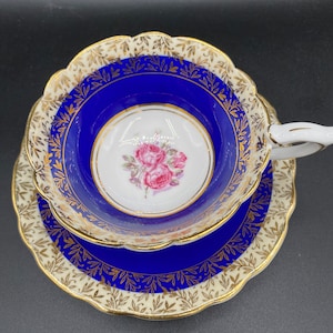 Royal Stafford Tea Cup & Saucer white bone china cobalt blue band, gold, red roses. *Scratch in saucer