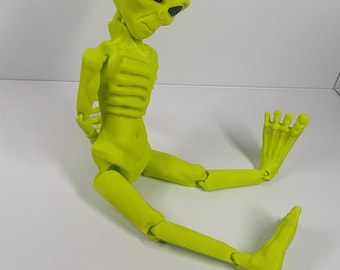 Neon Green Alien Figurine: Articulated Extraterrestrial Desk Decor