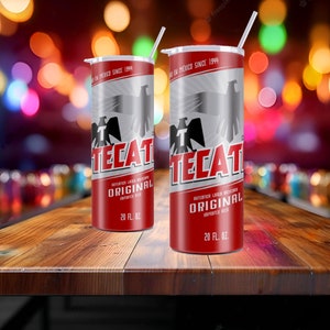 May include: Two cylindrical 20 fl. oz. tumblers with white lids and straws, featuring a red, silver, and black design inspired by Tecate beer branding. The tumblers display the Tecate logo, an eagle graphic, and the text Original Imported Beer.