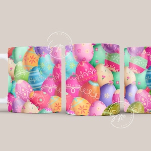 May include: A white ceramic mug with a colorful pattern of Easter eggs. The eggs are pink, blue, green, yellow, and purple with white designs.