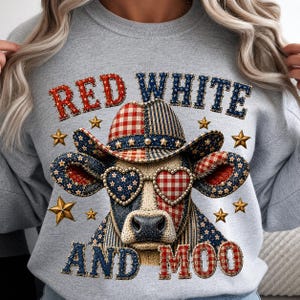 May include: A light gray sweatshirt featuring a graphic of a cow wearing a cowboy hat and heart-shaped glasses. The design incorporates red, white, and blue patterns with stars and the text "RED WHITE AND MOO" in a textured, stitched-style font.