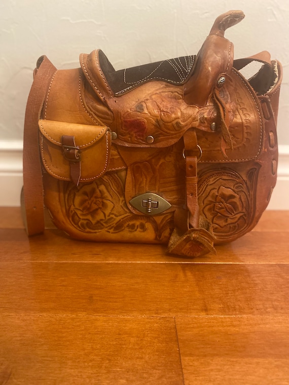 Vintage hand tooled leather saddle pocketbook.