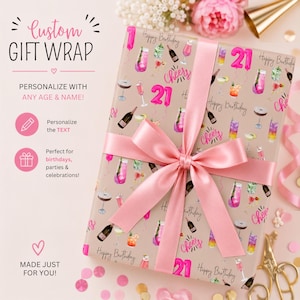 May include: A rectangular gift box wrapped in beige paper featuring a repeating pattern of colorful cocktails, champagne bottles, the number 21 in bright pink, and the text Cheers and Happy Birthday, tied with a wide, smooth, light pink ribbon.