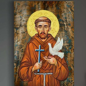 May include: A painting of Saint Francis of Assisi, a Catholic saint, holding a cross and a dove. The painting is done in a traditional style with a gold background and a halo around the saint's head.