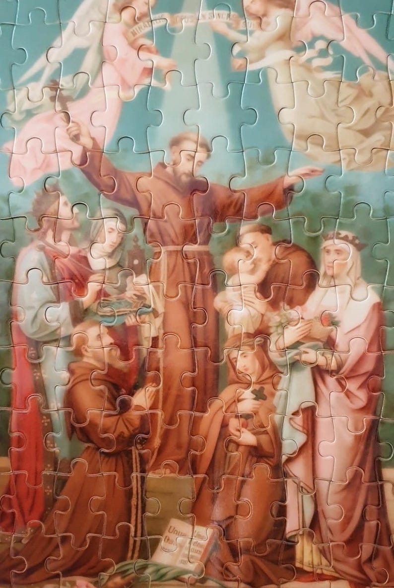 May include: A completed jigsaw puzzle featuring a religious scene with figures in brown robes, angels, and a blue sky background. The puzzle pieces are interlocked, showcasing the artwork's details.