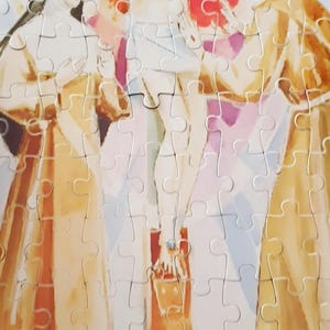 May include: A completed jigsaw puzzle depicting a religious scene. The image features a central figure on a cross, flanked by two other figures. The puzzle pieces are interlocked, forming a cohesive image with muted colors.