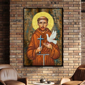 May include: A painting of Saint Francis of Assisi, a Catholic saint, holding a dove in his right hand and a cross in his left hand. The painting is done in a traditional style with a gold background and a halo around the saint's head.
