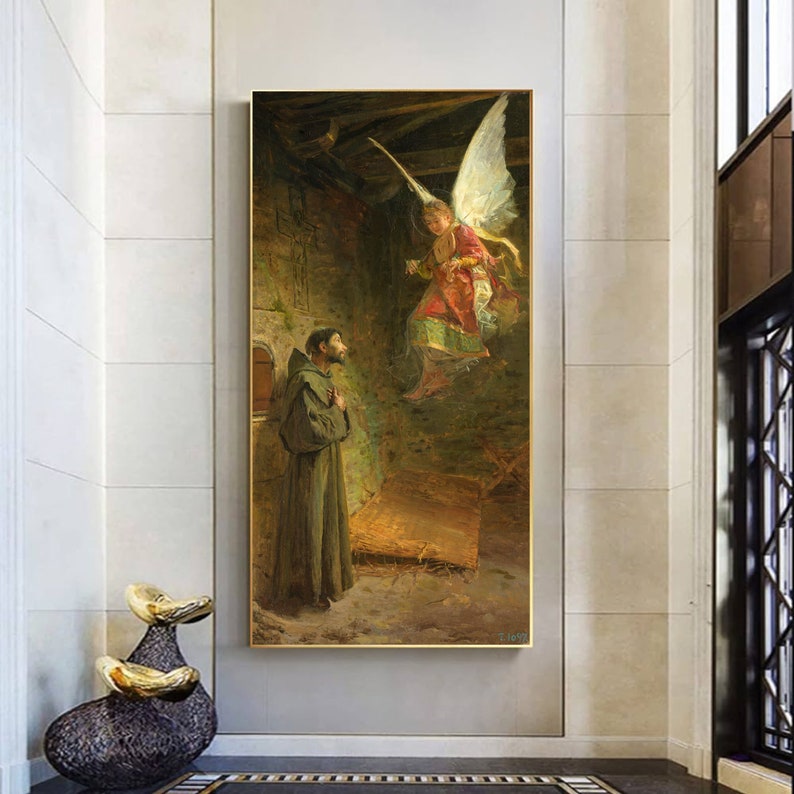 May include: A framed painting depicts a religious scene with a monk and an angel. The angel, with large white wings, is descending towards the monk. The artwork features a muted color palette with gold accents, creating a classic and historical aesthetic.