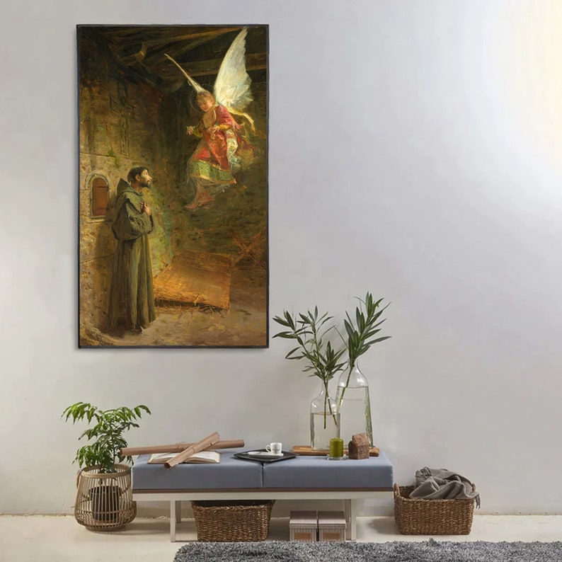 May include: A framed vertical painting depicts a religious scene. A robed figure stands in a stone structure, looking up at an angel with large white wings. The angel is wearing a red and gold garment. The painting has a dark, muted color palette.