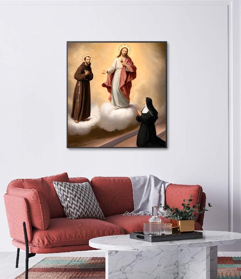 May include: A framed wall art print depicting a religious scene with a central figure in white and red robes standing on clouds, flanked by a figure in a brown habit on the left and a kneeling figure in a black habit on the right, all with halos.