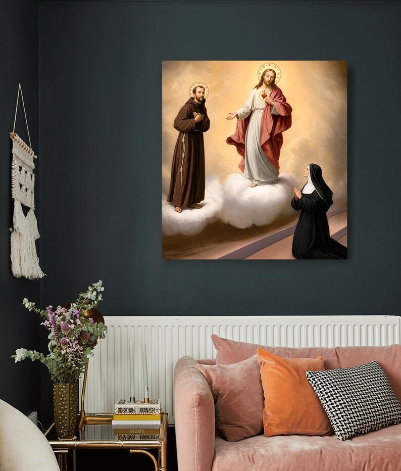 May include: A square wall art print depicting a religious scene with a figure in a brown habit standing on a cloud, a central figure in a white and red robe standing on a cloud, and a kneeling figure in a black habit with a white head covering.