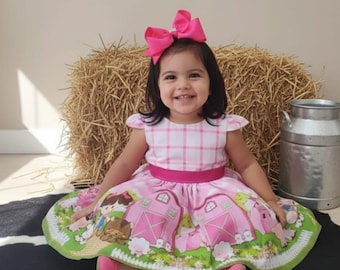Vestido de granja de lujo con fajín rosa.