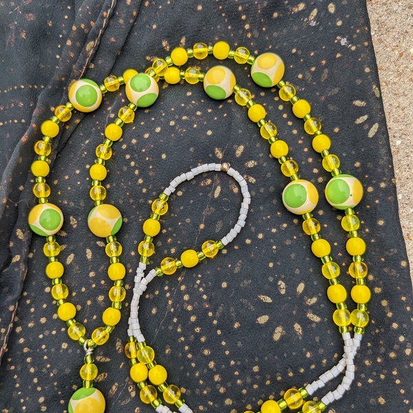 Yellow and green evil eye, 60s theme lanyard with white seed bead accents