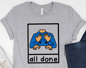 May include: A grey t-shirt with a graphic of a hand sign for "all done" in a white frame. The text "all done" is below the frame.