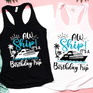 May include: Two tank tops with a white ship and palm trees graphic. The text on the shirts reads "Aw Ship! It's a Birthday Trip".