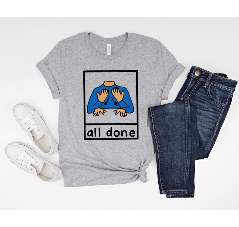May include: A grey t-shirt with a graphic of a hand sign for "all done" in a white frame. The text "all done" is below the frame.