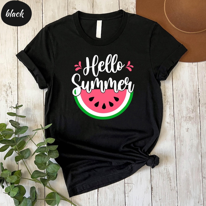 a black shirt with a watermelon print on it
