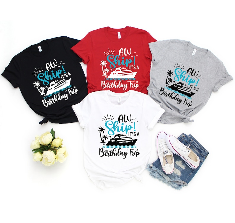 May include: Four t-shirts with a graphic of a cruise ship and the text "AW Ship! It's a Birthday Trip". The shirts are in black, red, grey, and white.