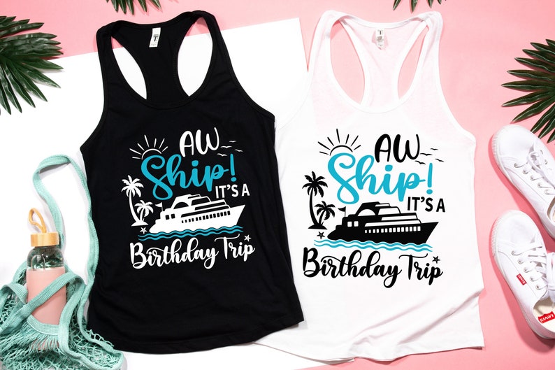 May include: Two tank tops with a white ship and palm trees graphic. The text on the shirts reads "Aw Ship! It's a Birthday Trip".