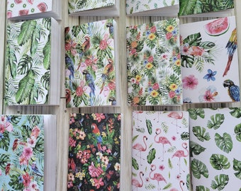May include: A collection of 12 small notebooks with various tropical-themed patterns. The covers feature designs of pineapples, flamingos, parrots, palm leaves, watermelon, and flowers.
