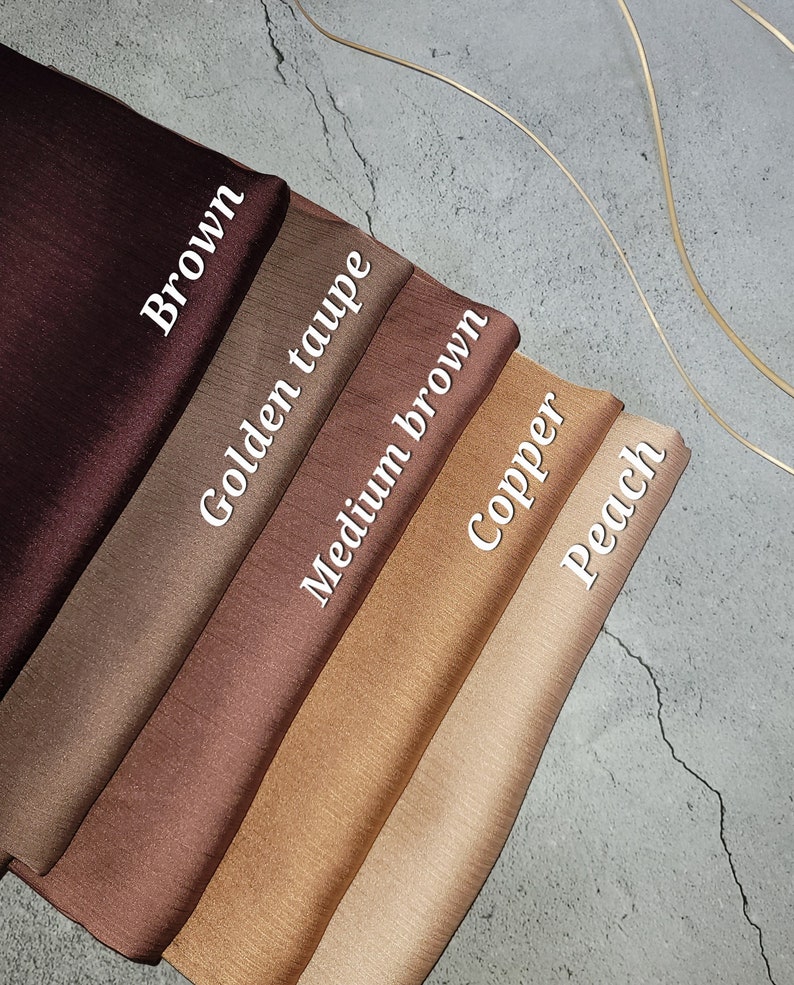 May include: Five fabric swatches in different shades of brown, from dark brown to light peach. The swatches are labeled "Brown", "Golden Taupe", "Medium Brown", "Copper", and "Peach".