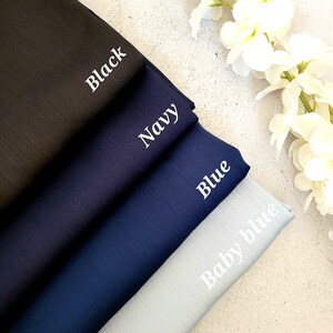 May include: Four fabric swatches in different shades of blue, from dark to light. The swatches are labeled "Black", "Navy", "Blue", and "Baby Blue".