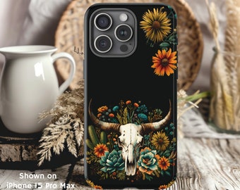 May include: Black phone case with a floral design featuring a skull with antlers, flowers, and leaves. The phone case is shown on an iPhone 13 Pro Max.