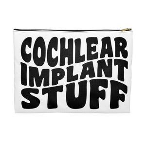 May include: White zippered pouch with black text that reads "Cochlear Implant Stuff" in a retro font.