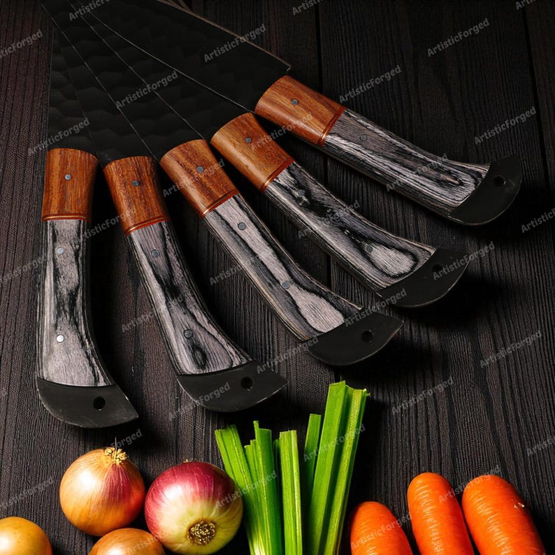 May include: A set of five kitchen knives with black blades and wooden handles. The handles have a two-tone design with a light wood top and a black and gray patterned base. The knives are arranged on a dark wooden surface with vegetables.
