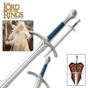 May include: A silver sword with a blue handle and a silver blade. The sword is displayed on a wooden plaque with the words "The Lord of the Rings" on it.