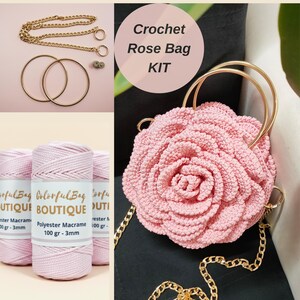 May include: A Crochet Rose Bag KIT featuring three spools of 100g 3mm light pink polyester macrame cord, two gold metal circular handles, a gold chain strap, and a finished light pink crocheted rose-shaped bag with gold metal handles.