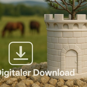 May include: A white ceramic planter shaped like a small castle with a green pine tree growing inside. The planter is sitting on a pile of rocks with a blurred background of a field and a cannon.