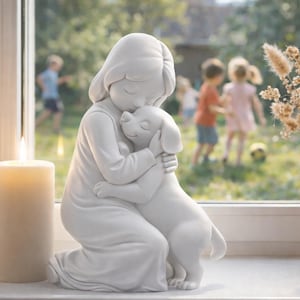 May include: A white ceramic sculpture of a girl kneeling and hugging a dog. A lit candle and a vase of dried flowers sit on a windowsill. Children play in the background, visible through the window.