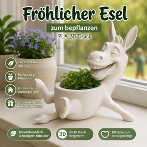 Puede incluir: Una maceta blanca de PLA impresa en 3D con forma de burro y expresión sonriente, que contiene una pequeña planta verde. La imagen incluye el texto en alemán: Fröhlicher Esel, zum bepflanzen, PLA 3D Druck, Leicht & stabil aus PLA, Perfekt für kleine Pflanzen, Für Innen & Außen geeignet, Originelle Deko & tolle Geschenkidee, Umweltfreundlich & biologisch abbaubar, Im 3D Druck hergestellt, Mit Liebe zum Detail gefertigt.