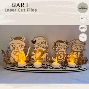 May include: A laser-cut wooden advent display featuring four cats wearing holiday hats, each holding a number from one to four. The base includes four small LED tea lights and decorative star cutouts. Text includes EY ART Laser Cut Files, 3 mm optimized, SVG, LBRN, and Private use only.