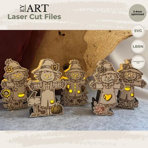 May include: Five laser-cut wooden scarecrow figures featuring cutout details that glow with yellow light. Each scarecrow wears a hat and overalls, with some designs including sunflowers, pumpkins, or birds. The text EY ART Laser Cut Files is visible.