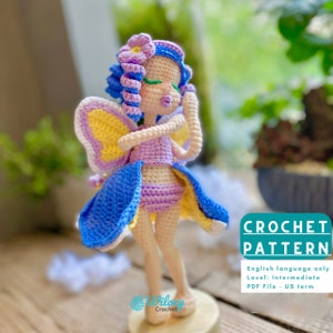 May include: Crochet pattern for a fairy doll with blue hair, purple and yellow wings, and a purple dress. The pattern is written in English and is for an intermediate skill level. The pattern is available as a PDF file.
