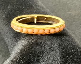 Vintage 9ct gold and coral scarf ring in original velvet box.