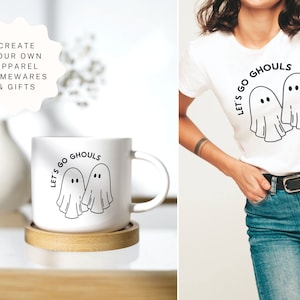 K&ouml;nnte beinhalten: Eine wei&szlig;e Keramiktasse mit einer schwarzen Grafik von zwei Geistern und dem Text "Let's go ghouls".